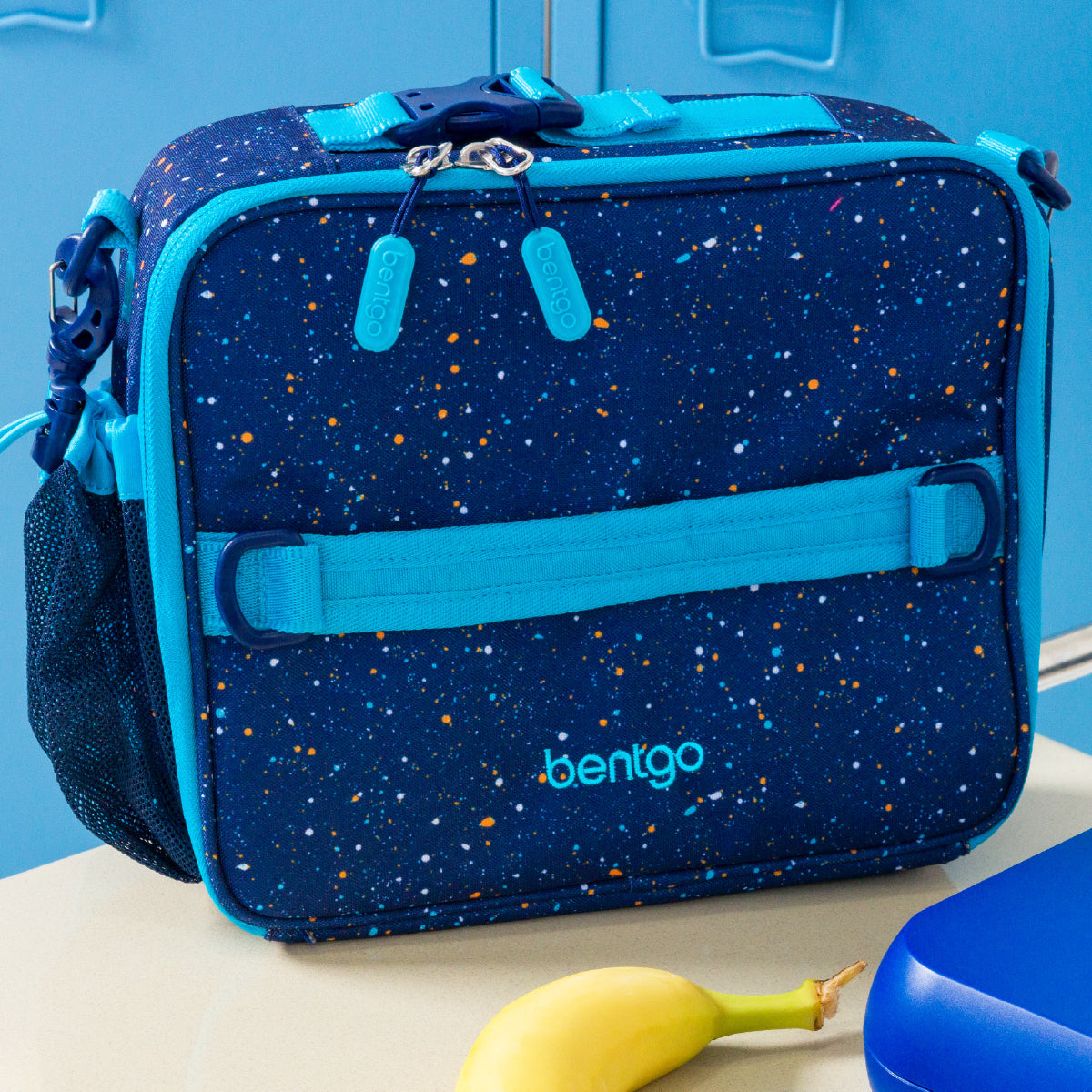 Blue insulated lunch bag with star pattern on a blue background
