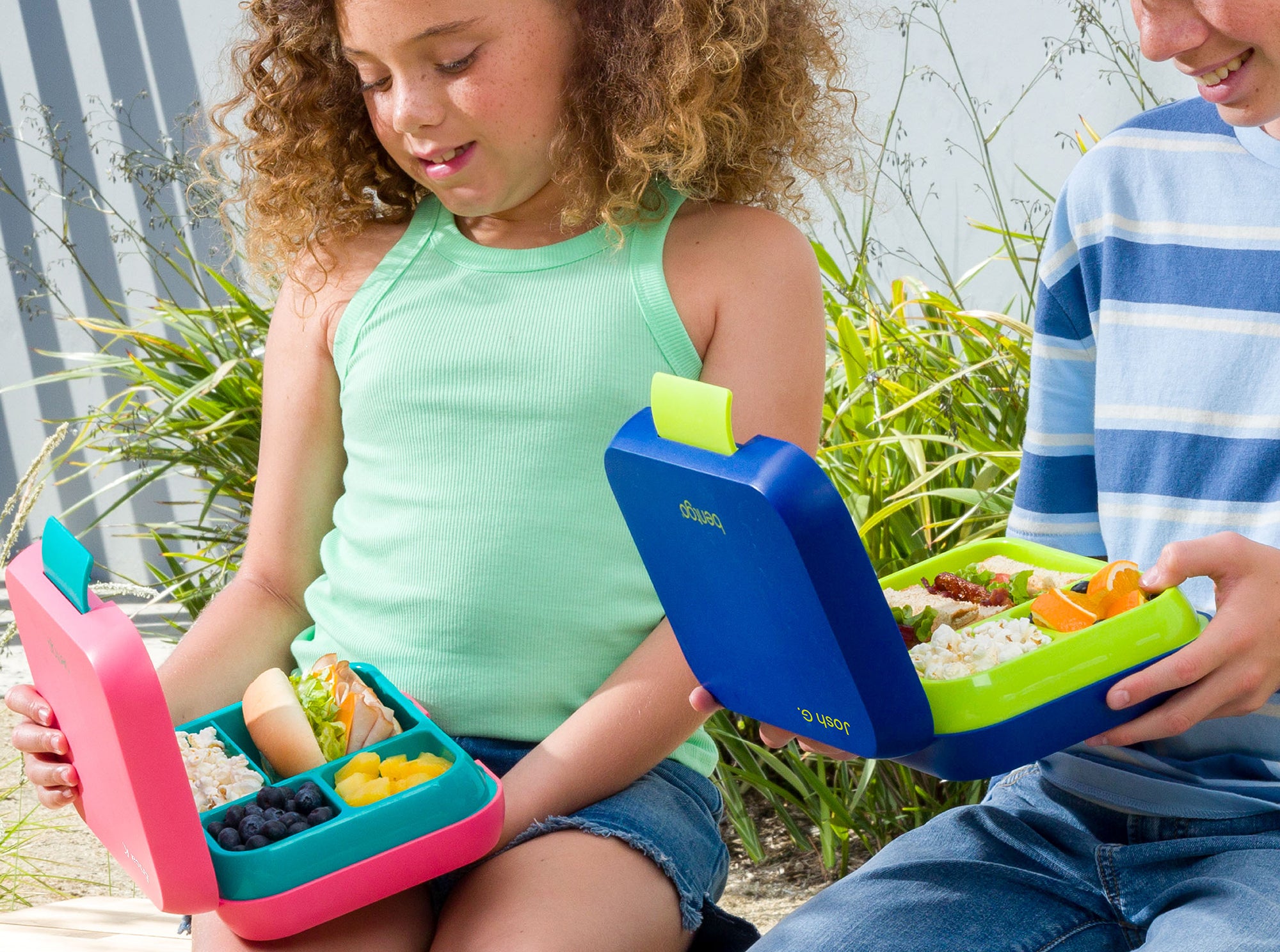 Kids holding Bentgo Lunch Boxes